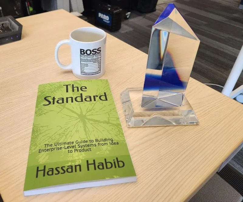 Five years at Microsoft — crystal, The Standard, and the BOSS mug.