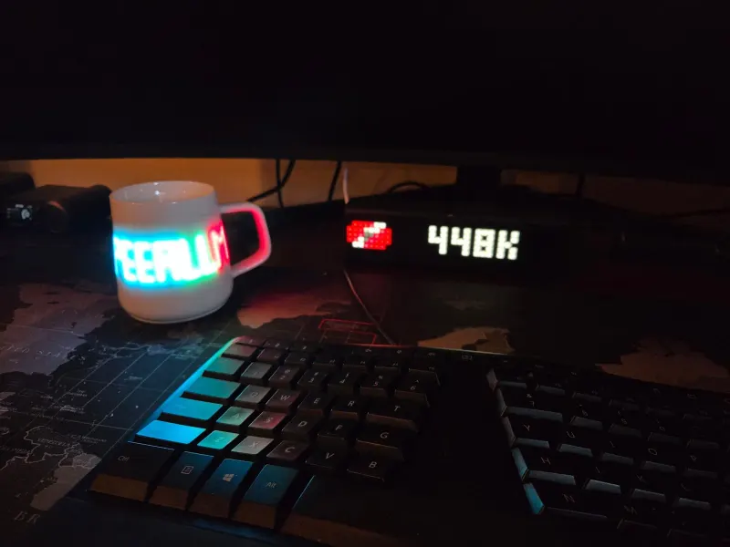 The PeerLLM mug glows, and the counter reads 448K.