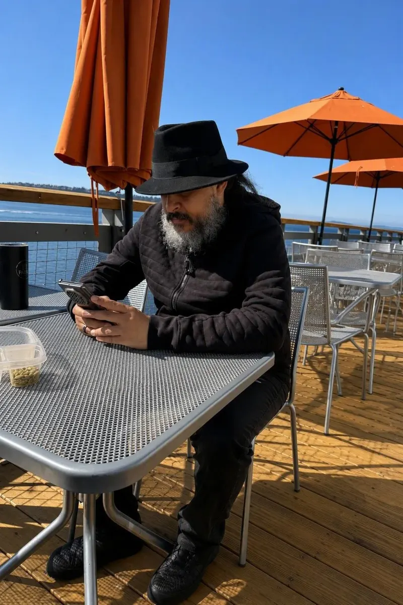 Office of the day: a pier, an umbrella, and the sea.