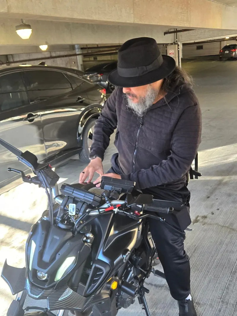 Two wheels, all black — pre-flight checks.