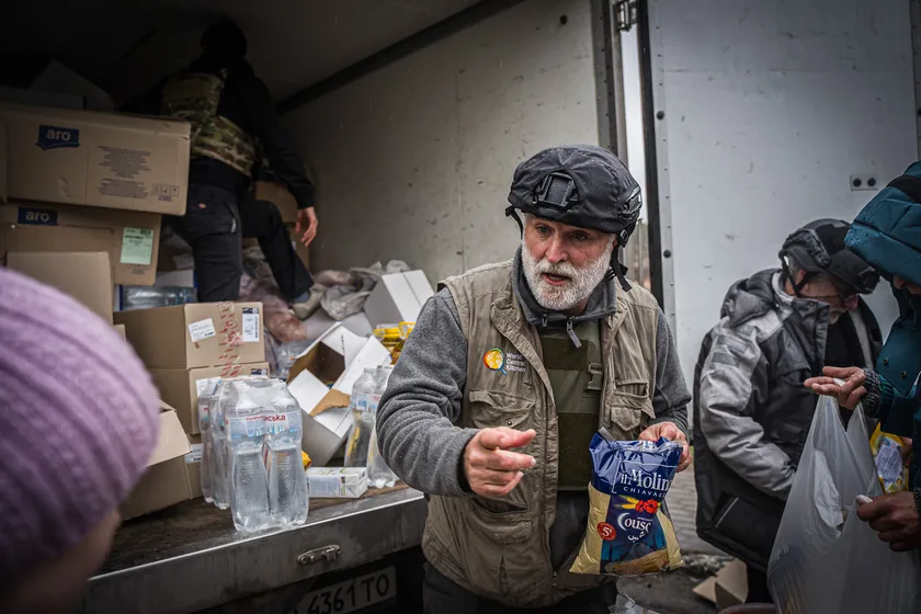 José Andrés handing out food and water from the back of a World Central Kitchen truck